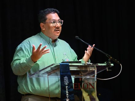 Luis Garay at an Elon podium