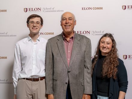 iles Hayford (left) and Molly Lorden (right) stand with Paul Parsons,