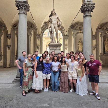 Students and faculty standing in Medici Palace.