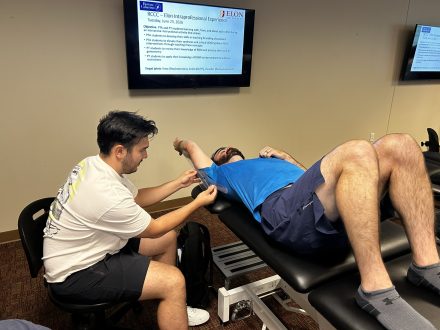 Elon DPT student measuring the shoulder of an RCCC PTA student
