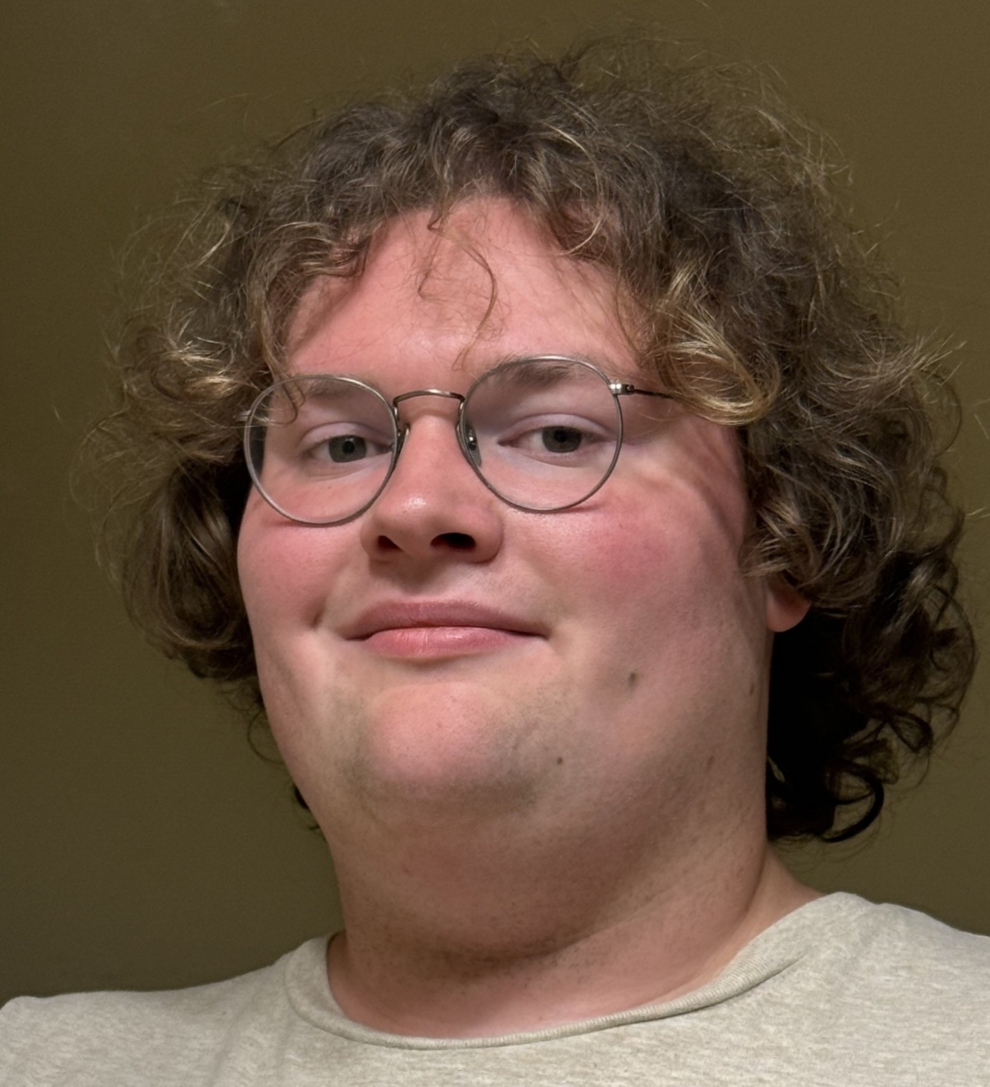 Headshot of a person wearing glasses