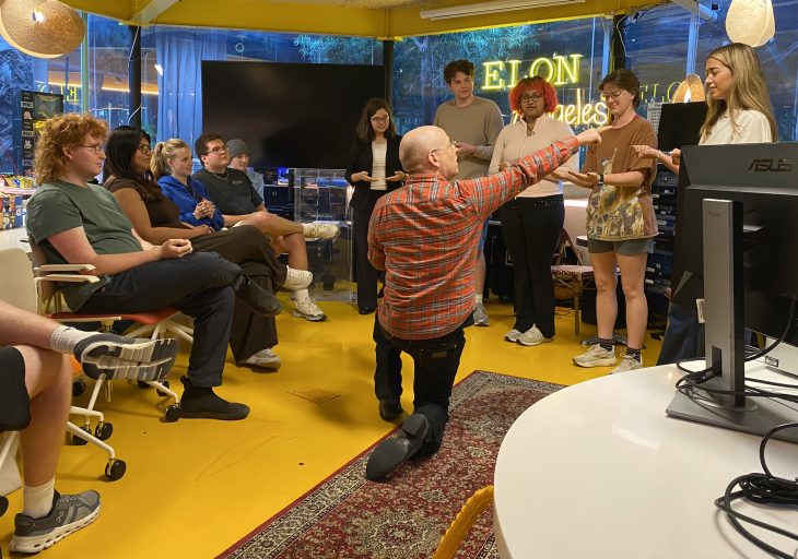 Students participate in an interactive workshop at Elon Los Angeles, engaging in a hands-on group exercise led by an instructor in a collaborative learning space.