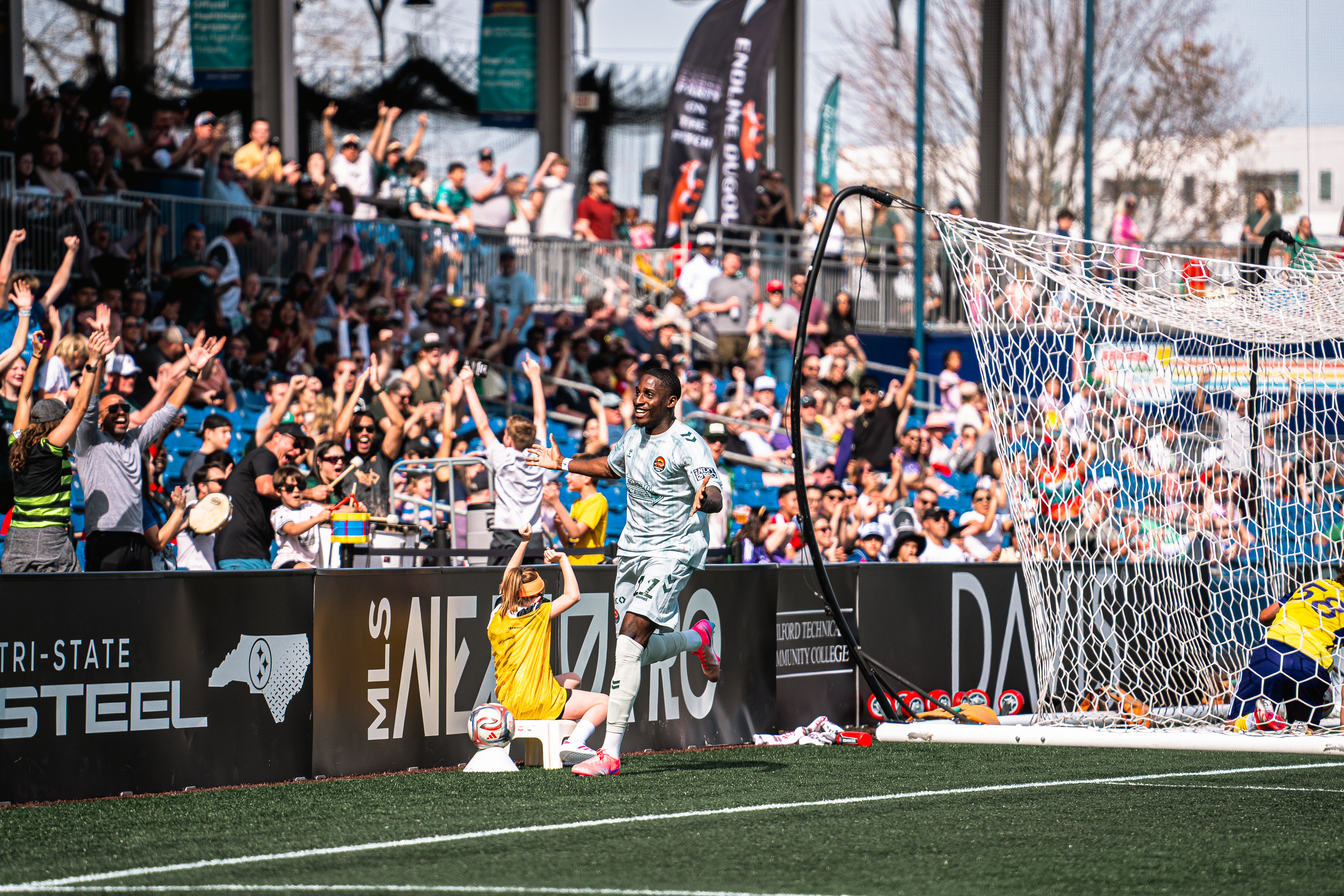 Soccer player on the field in front of fans in the stadium