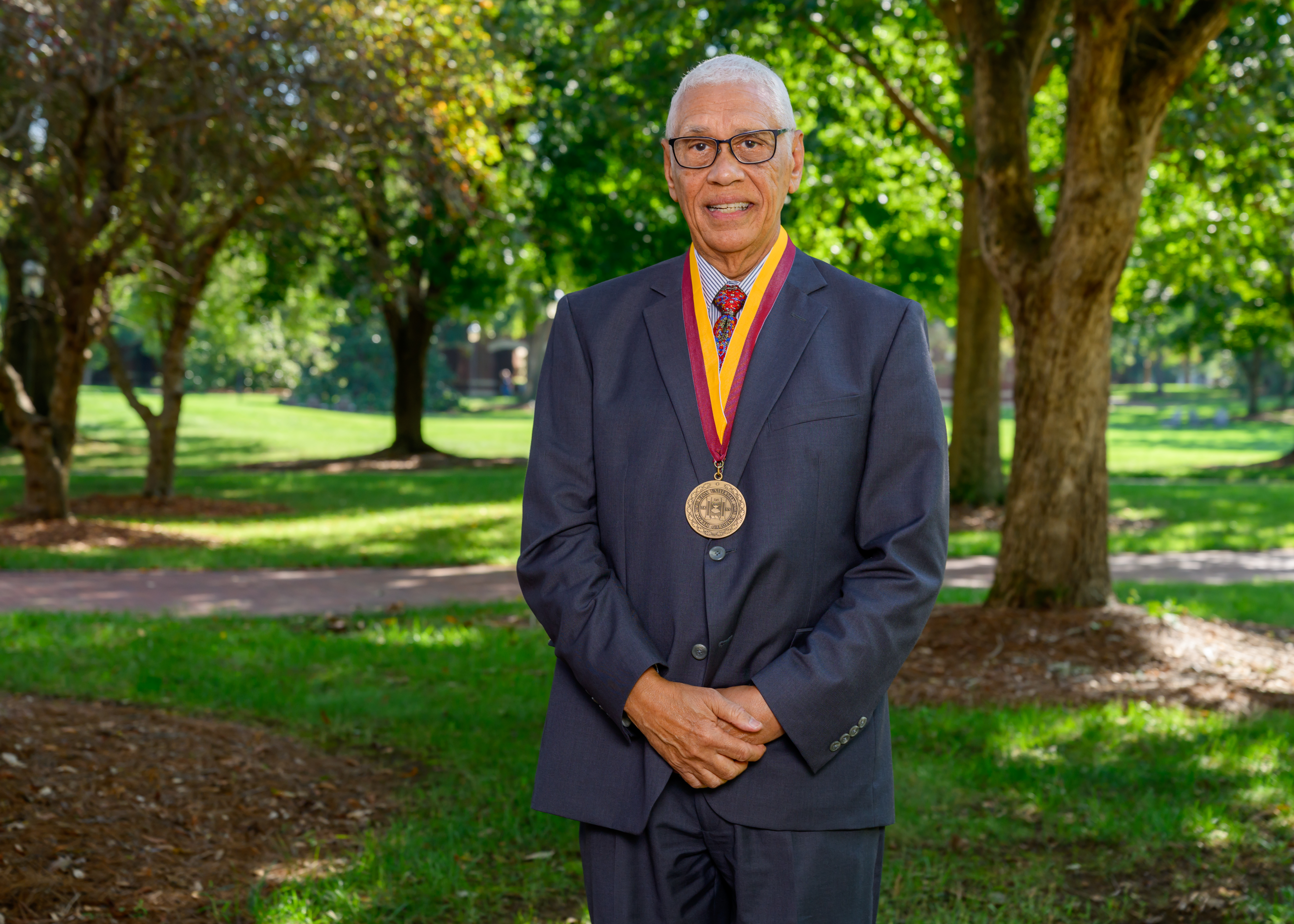 Portrait of Don Grady wearing the Elon medallion outside