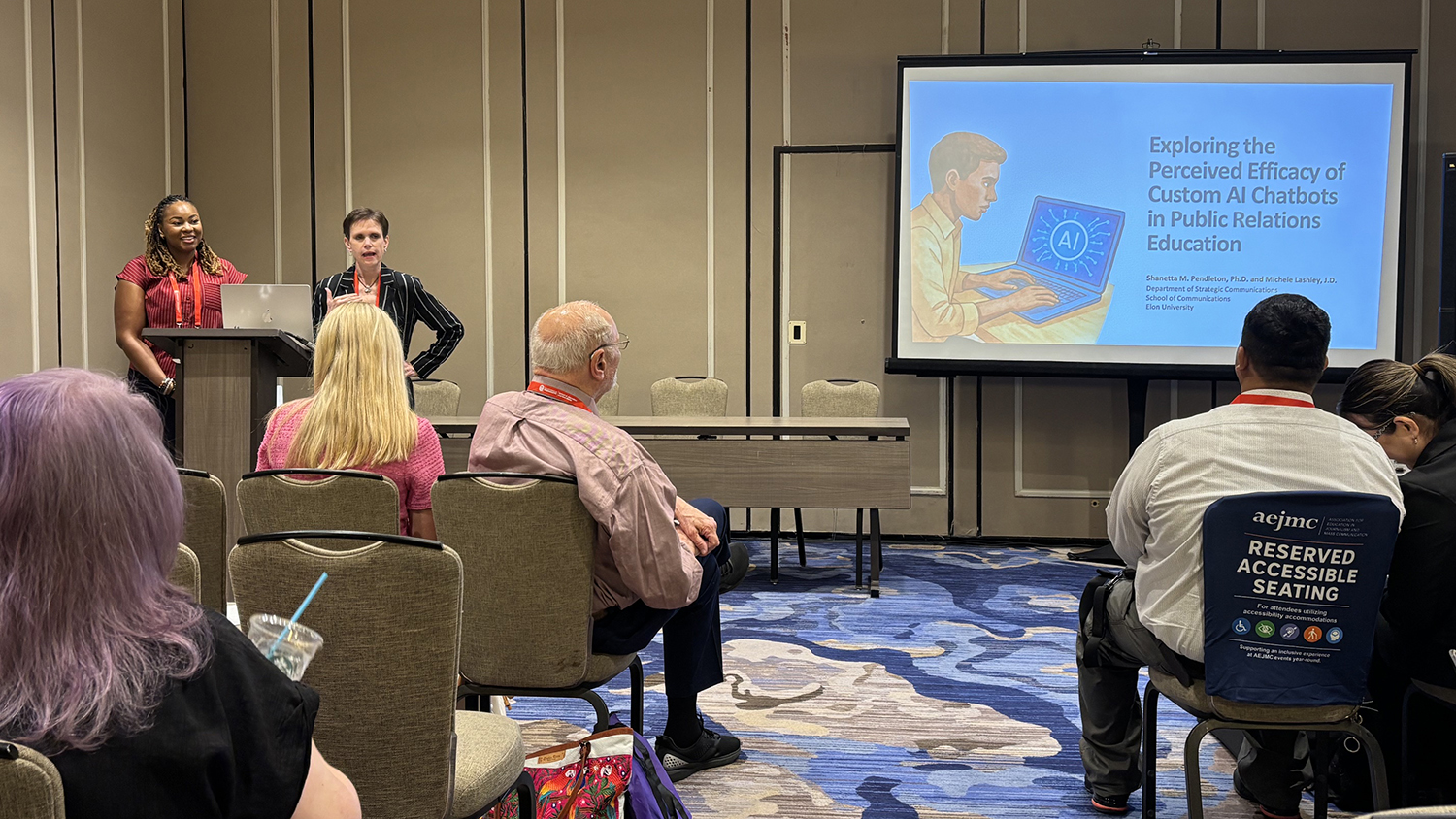 Elon University professors Shanetta Pendleton, left, and Michele Lashley present research on AI chatbots in public relations education at the 2026 AEJMC Conference.
