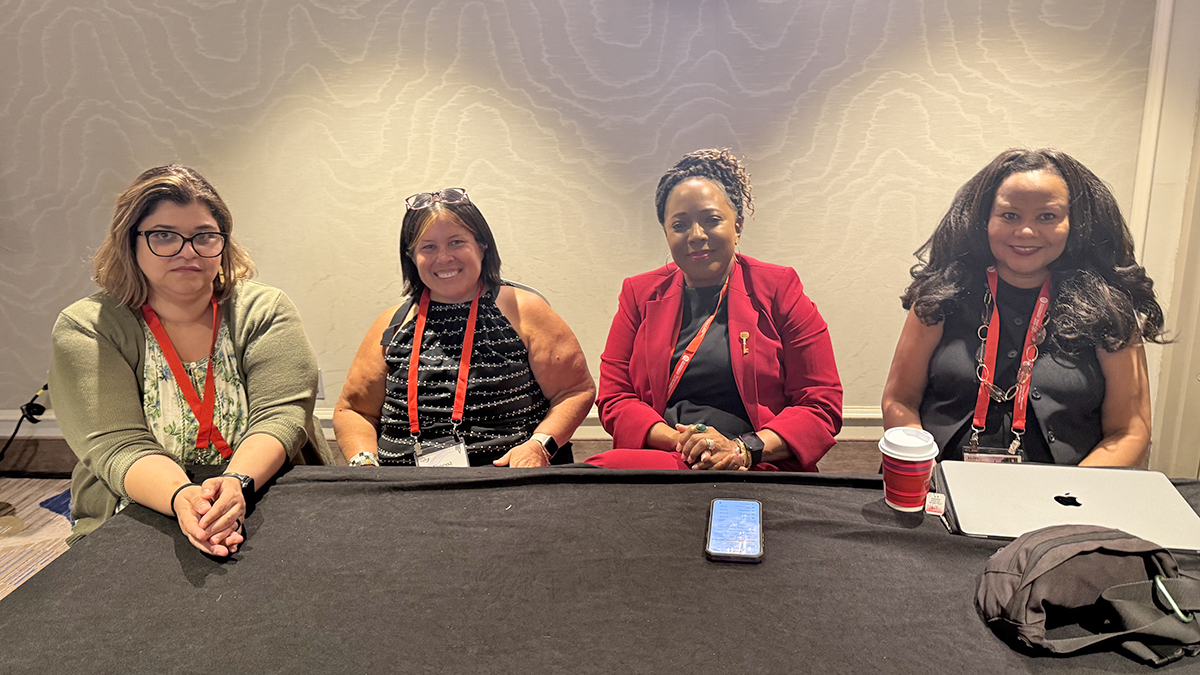 Vanessa Bravo speaks during an AEJMC teaching panel alongside Maria De Moya, Carolyn Walcott and Mia Moody.