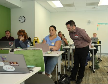 Picture of Tristan engaging with a faculty