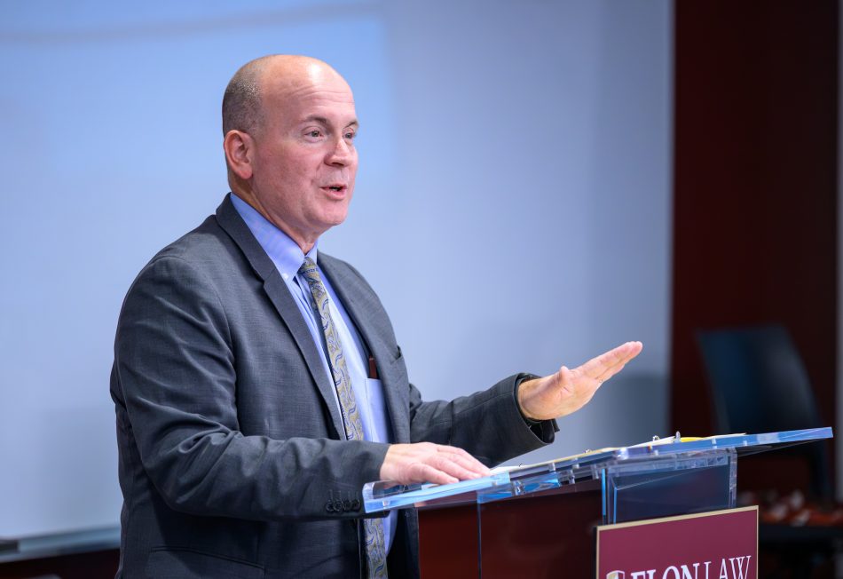 A person speaking at a podium
