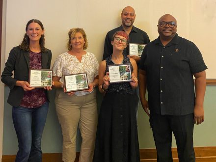 Recipients of the Elon College, the College of Arts and Sciences, 2026 College Excellence Awards posing with their plaques.