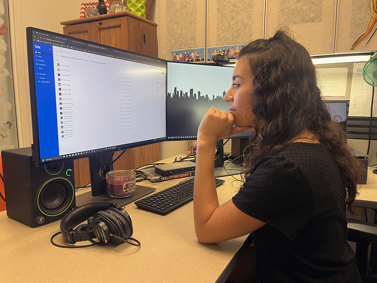 Miranda Burgos sits at her desk during her summer internship with the Big Ten Network.