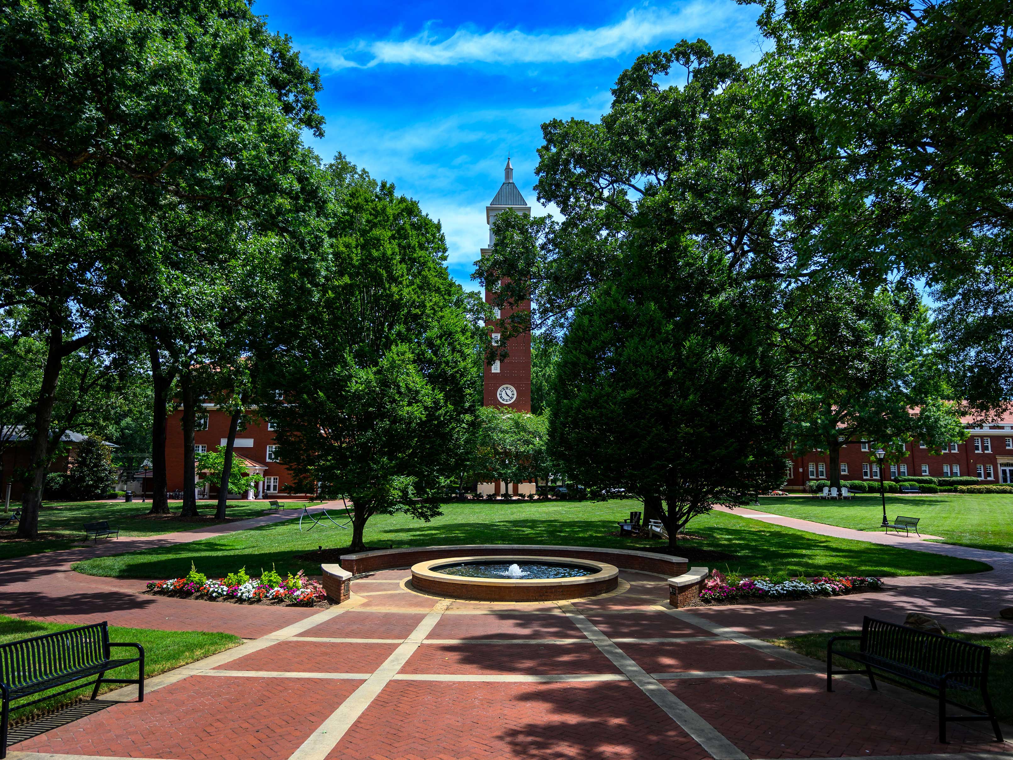 A photo of the Evans Clock Tower in the residential quad of the Queens campus.