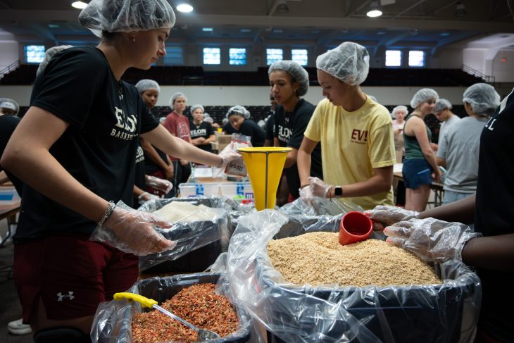 Student volunteers pack meals for Rise Against Hunger