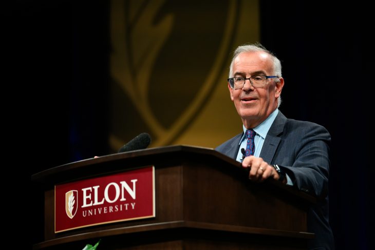 David Brooks speaks from behind an Elon University podium during Fall Convocation.