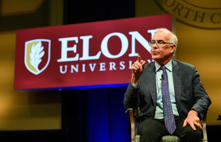 David Brooks gestures while seated onstage during a question-and-answer session following his Fall Convocation address.