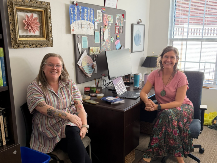 Jill McSweeney, CATL assistant director, and Anne-Marie Iselin, associate professor of psychology, smiling in Iselin's office.