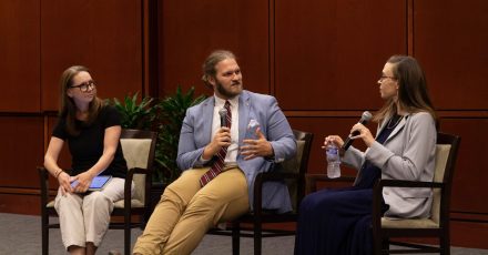 Three people talking during a question and answer session. 
