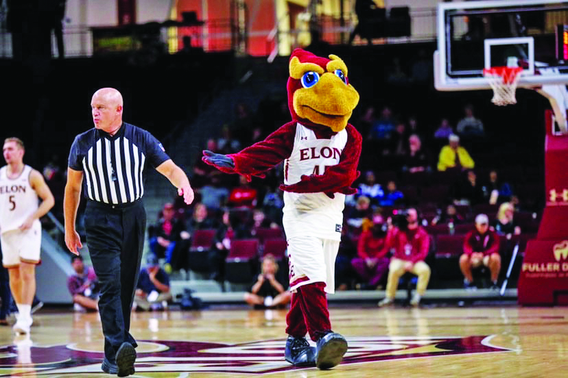 Elon’s Phoenix mascot walks across the basketball court during a men’s basketball game.