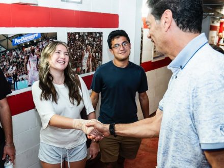 Elon student greeting Pistoia Basket President Joseph Mark David