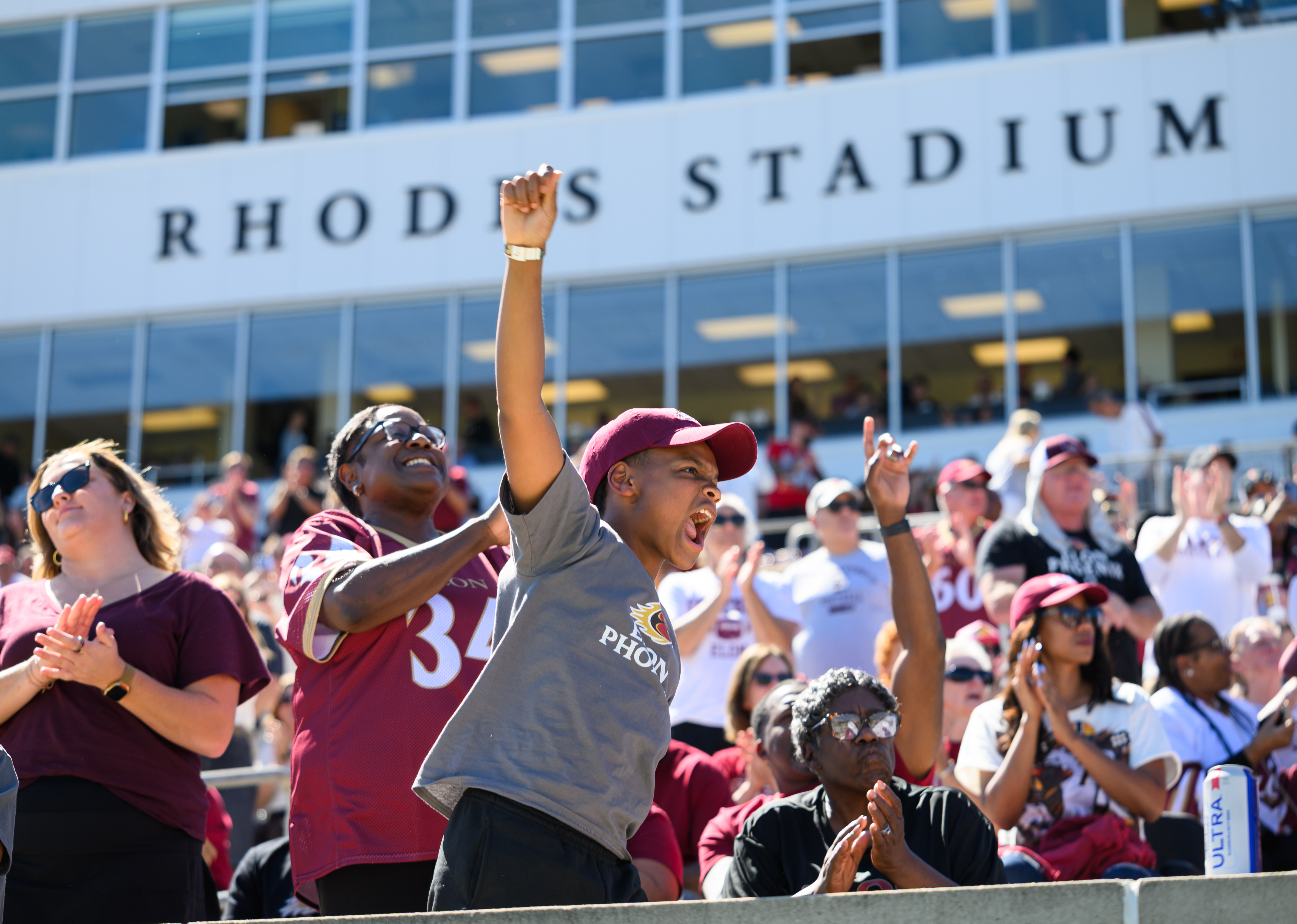 Fans cheer from the stands at Rhodes Stadium during Elon’s Family Weekend.