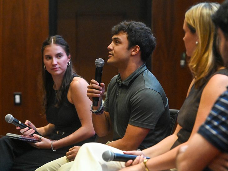 Jack Gill, Elon student, talks during panel.