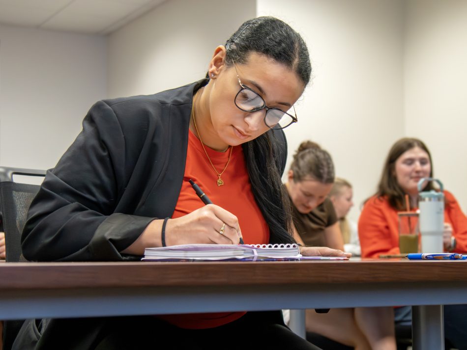 Mayar Elgeyoshi takes notes in an Elon Law classroom