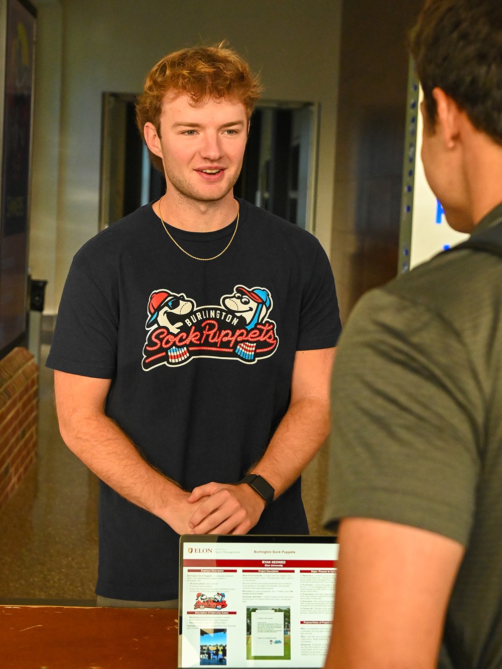 Elon student Ryan Nedwed ’27 talks in Snow Atrium.