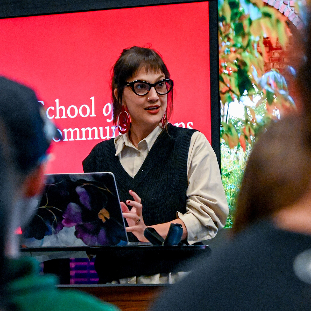 Pulitzer Center journalist Sophie Neiman at an Elon University podium