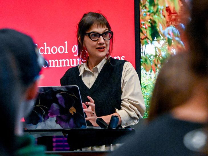 Pulitzer Center journalist Sophie Neiman at an Elon University podium