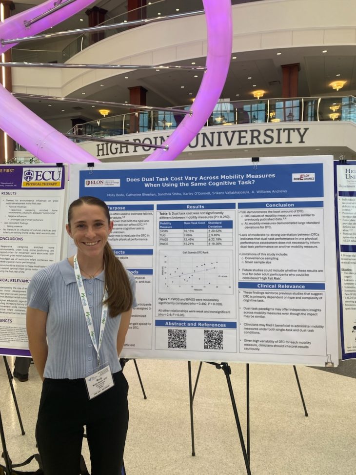 Presenter in front of her poster