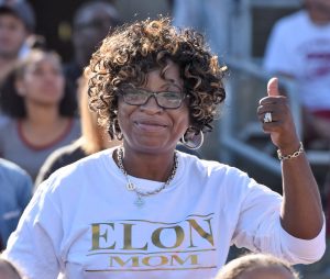 Photo of parent at football game during family weekend