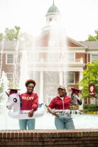 Two Seniors in Fonville Fountain with inflatable animals 
