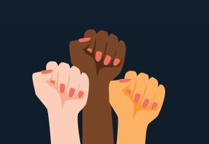 Illustration of three raised fists in varying skin tones each with pink fingernails.
