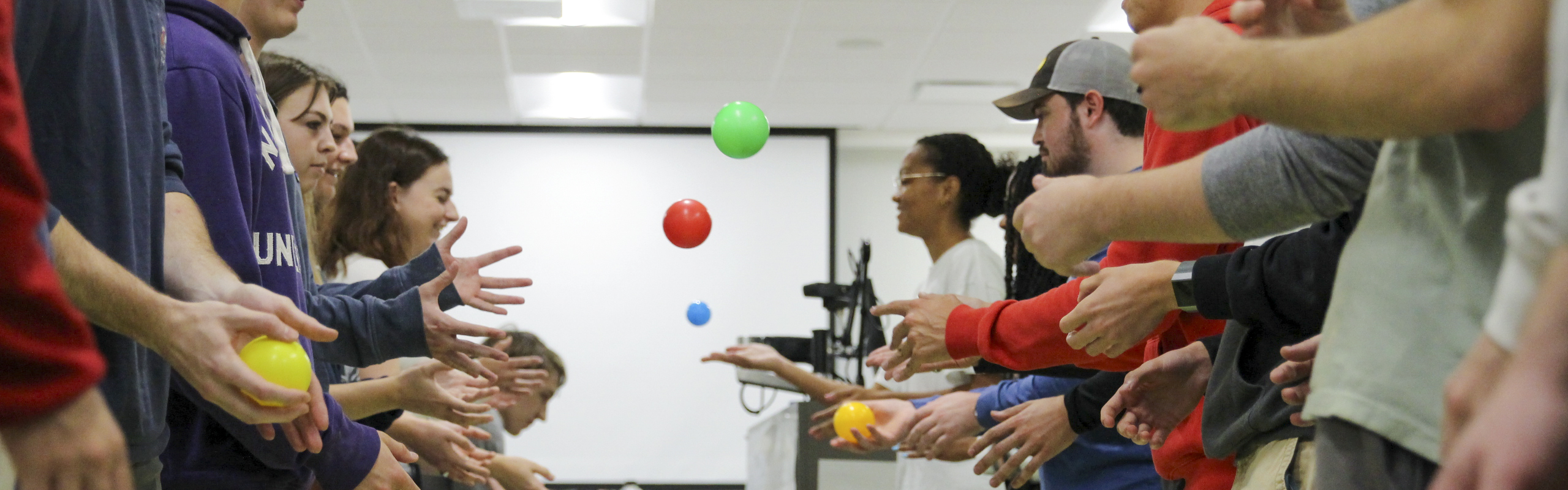 Students toss colored balls in a computer science Scrum Method exercise. Earn your bachelor degree in computer science at Elon University.