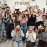 Picture of all students in the class holding the VR headset