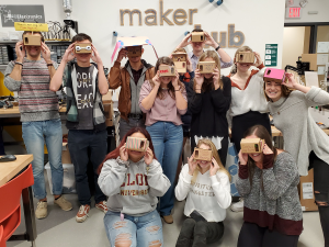 Picture of all students in the class holding the VR headset