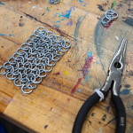 Chainmail and plyers on table