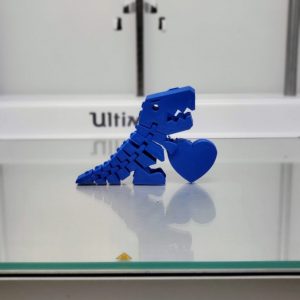3d printed dinosaur holding a heart
