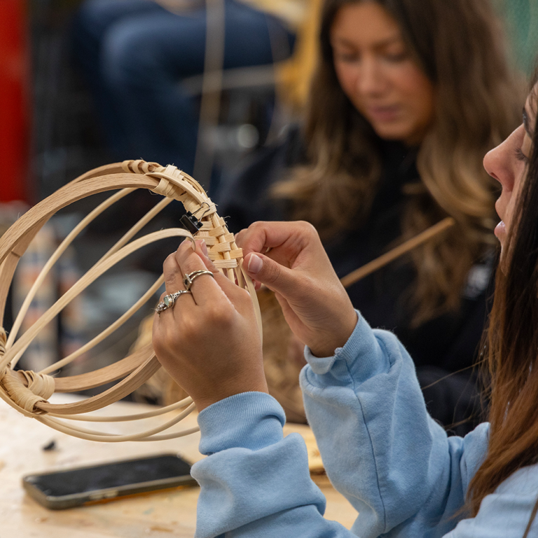Student working on her basket.