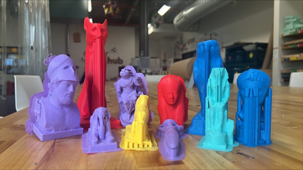 Multicolored 3D printed artifacts on a table