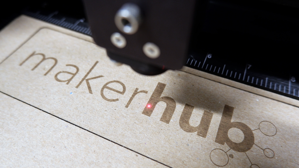 Maker Hub logo under the laser engraver
