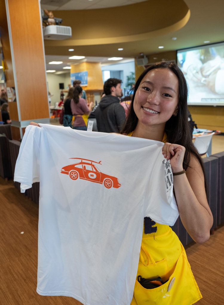 Student holding up t-shirt