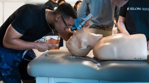 Elon PA student practicing intubation on a mannequin
