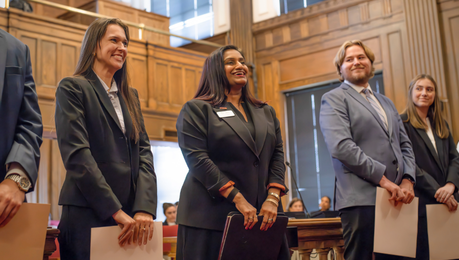 Students in a courthouse being sworn in as licensed attorneys. PreLaw Magazine names Elon Law is one of the best law schools in NC for practical training.
