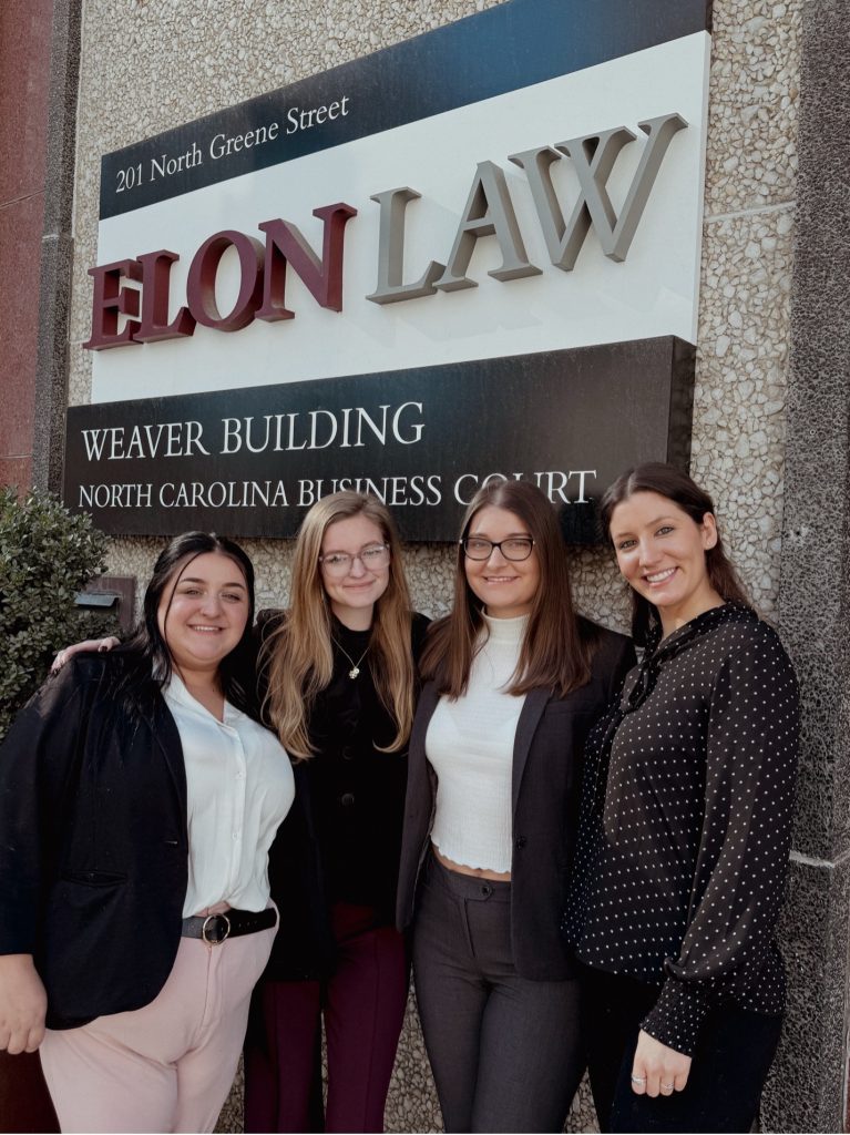 A group of women in front of Elon Building
