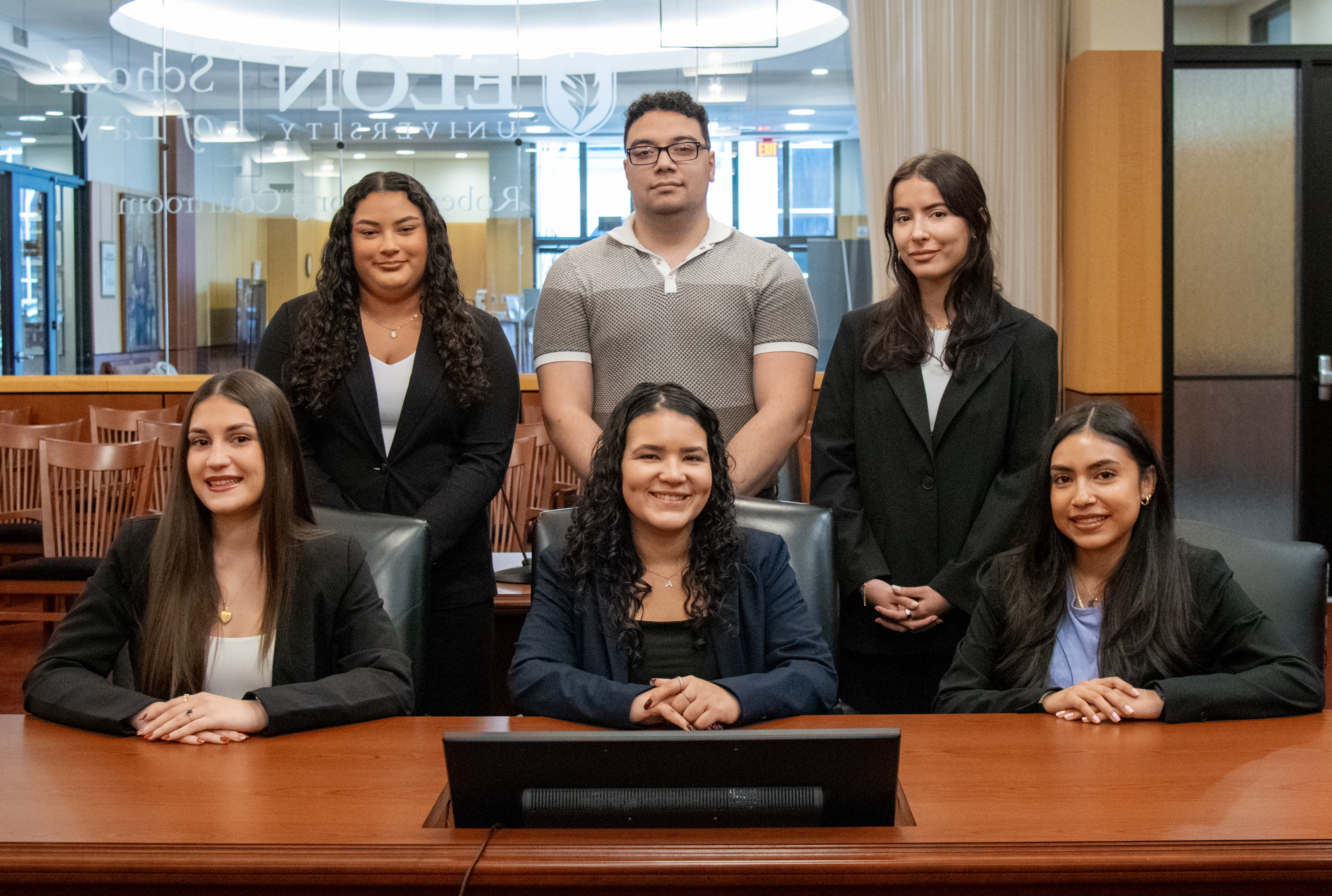 Six law students in a courtroom